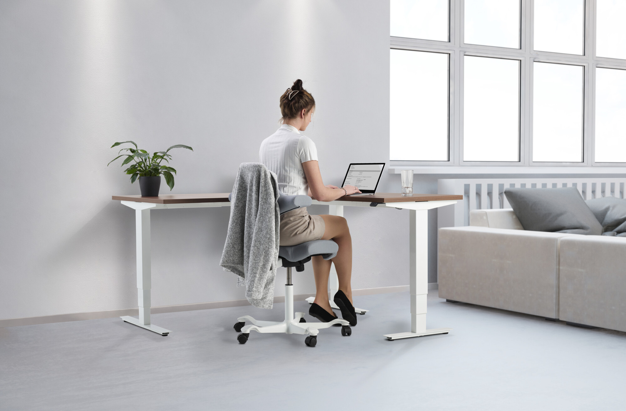 The correct posture when using an ergonomic chair for optimum comfort and proper posture preventing back and neck damage. Forearms should be in-line with your desk so that your elbows are bent at a 90-degree angle when typing or using a mouse and your feet remain flat on the floor or on an ergonomic footrest.