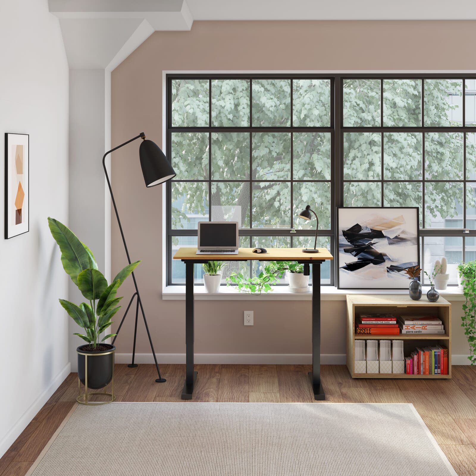Black framed oak top standing desk in home office set up in front of a large window. 