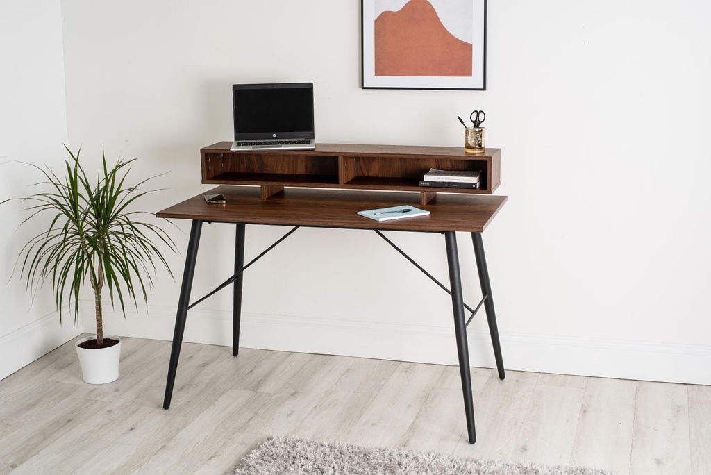 A wooden and black hair pinned leg smart desk with two tiers. 