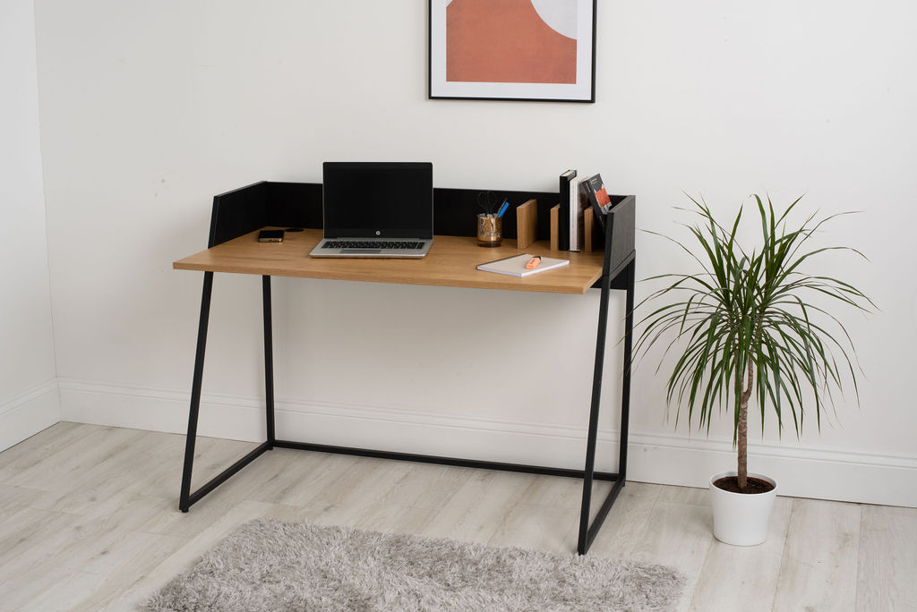 A brown desktop and a black framed smart desk.