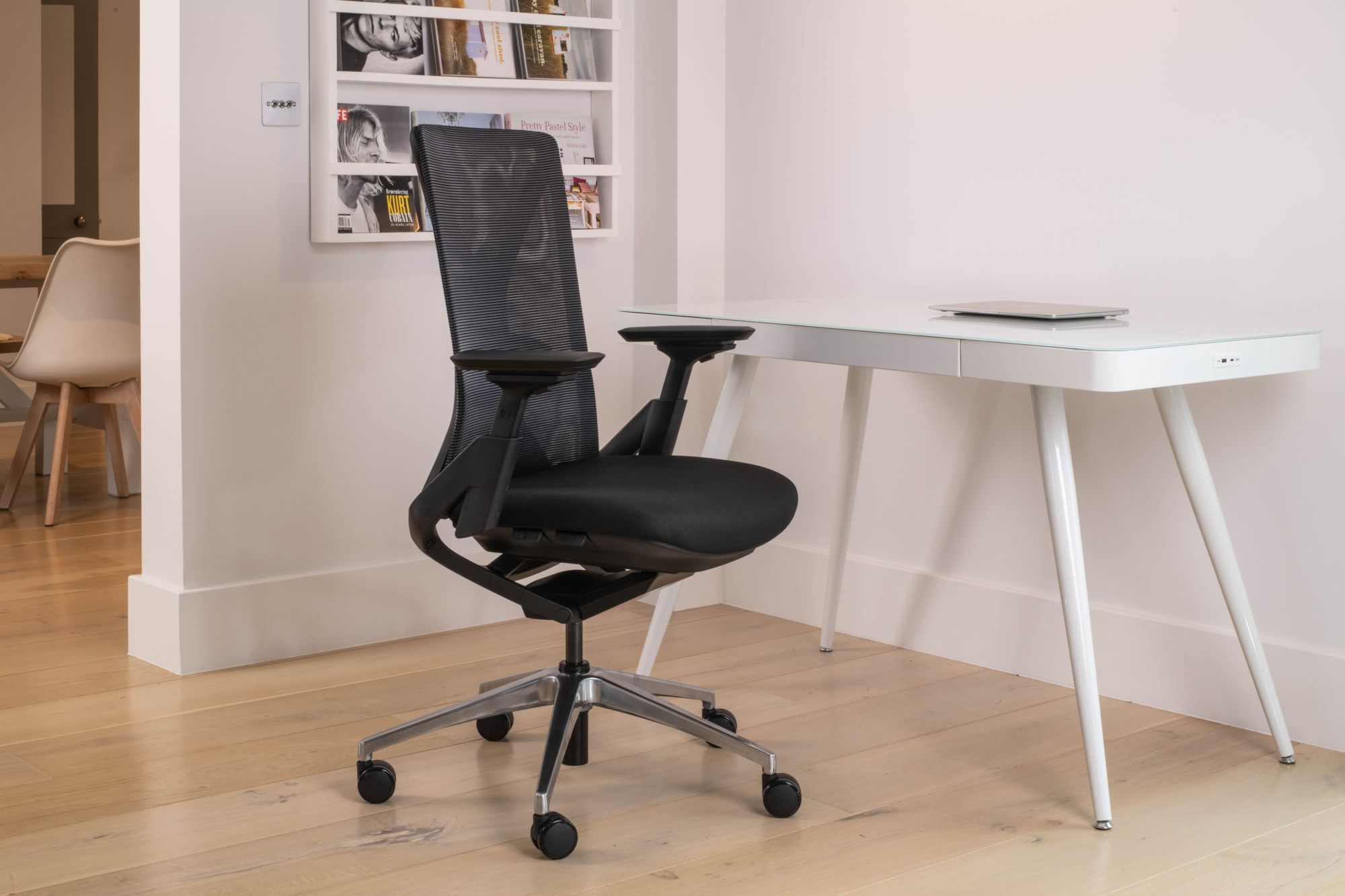An urban fully ergonomic black home office chair with a wishbone back detail.