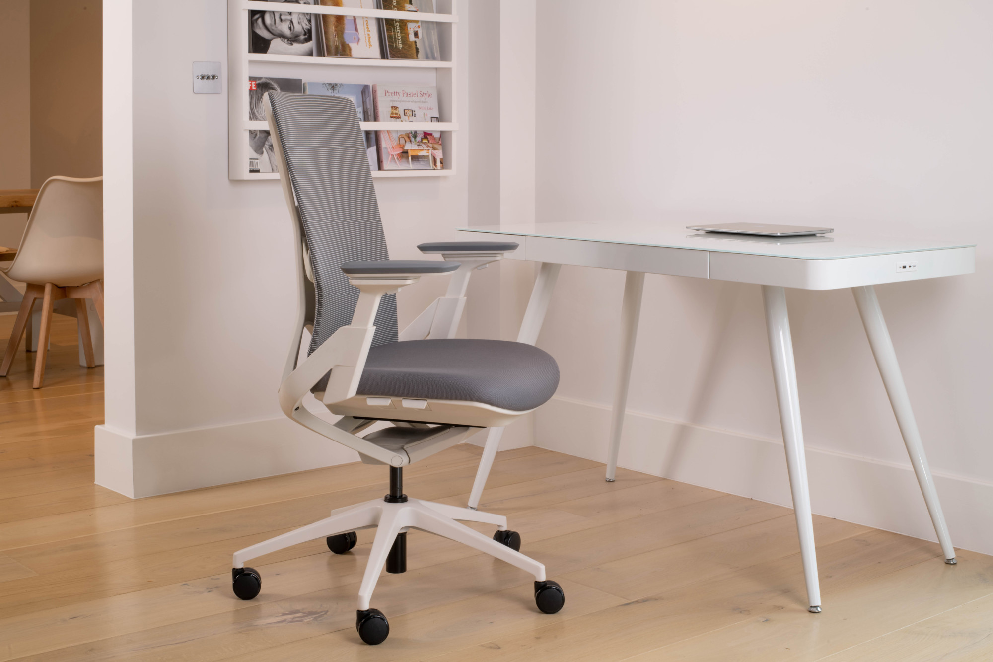 The Maja ergonomic chair features a grey premium Italian mesh back with a white ribcage body. 