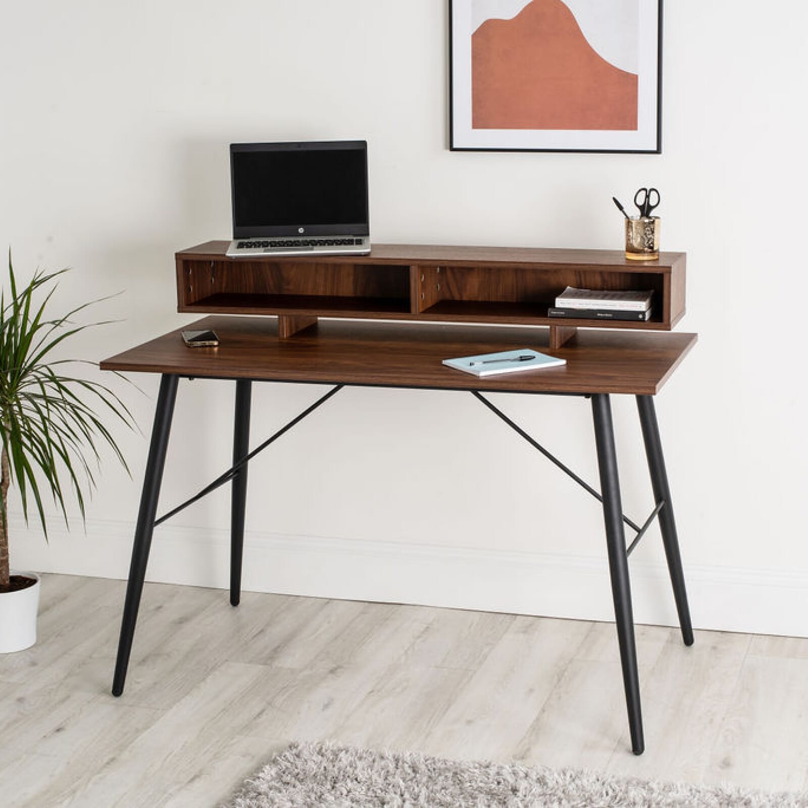 The Axel Smart Desk from Koble features an integrated wireless charging point to keep your phone topped up while you work. 