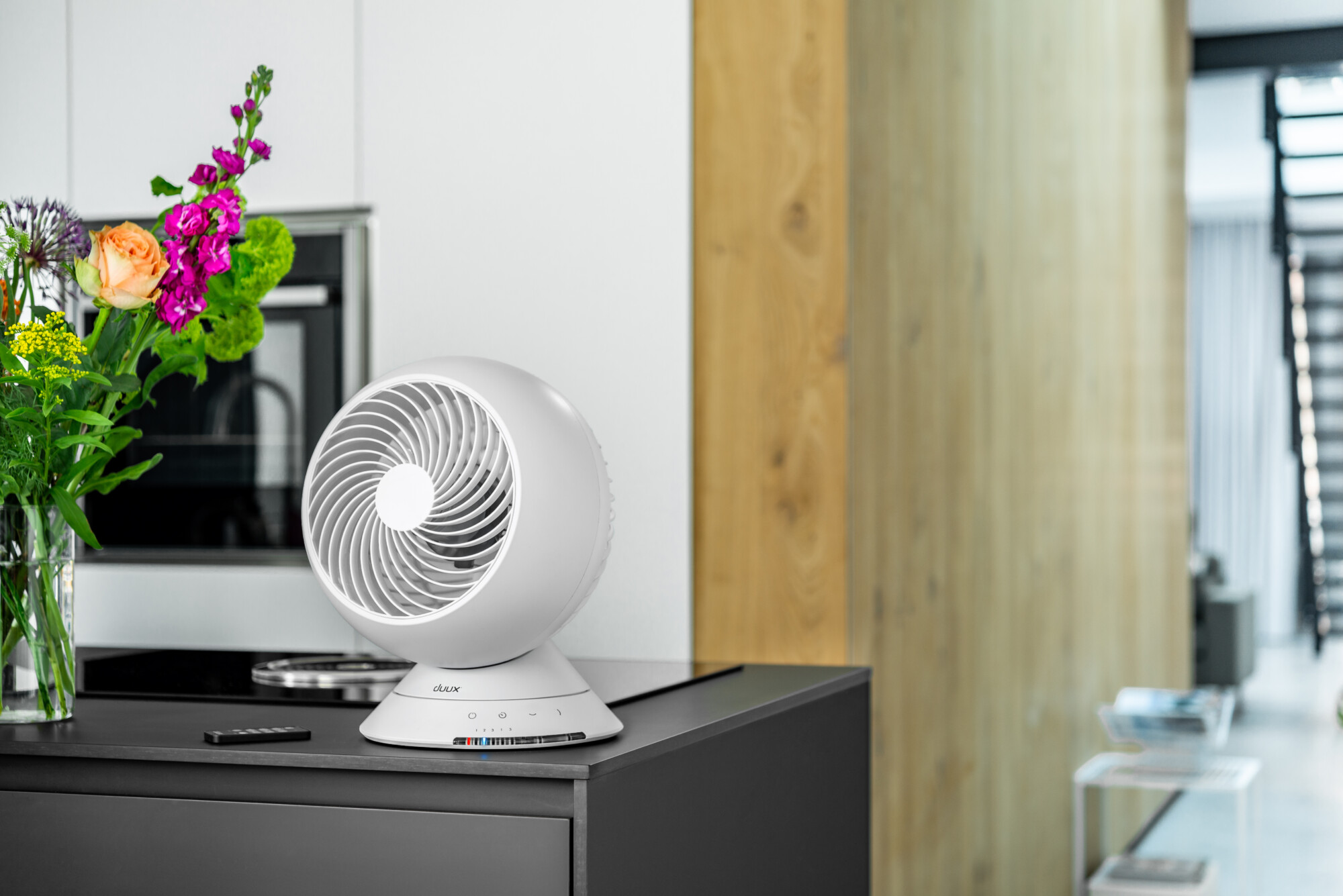 The compact Globe Table Fan in White is a great accessory for your home office desk.