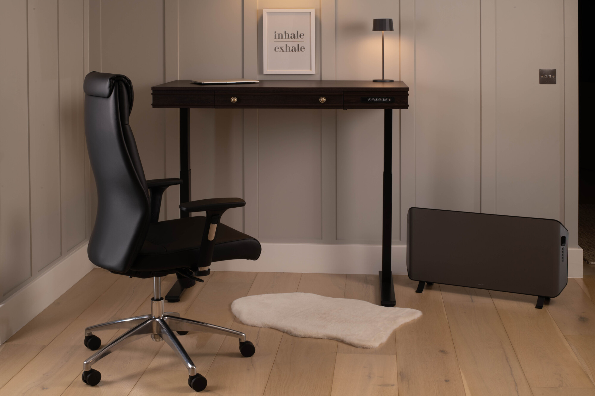The Oskar Height Adjustable Desk from Koble Designs, a retro design with a mahogany effect desktop and black frame finish. Sit or stand at your chosen height from 75cm to 125cm.