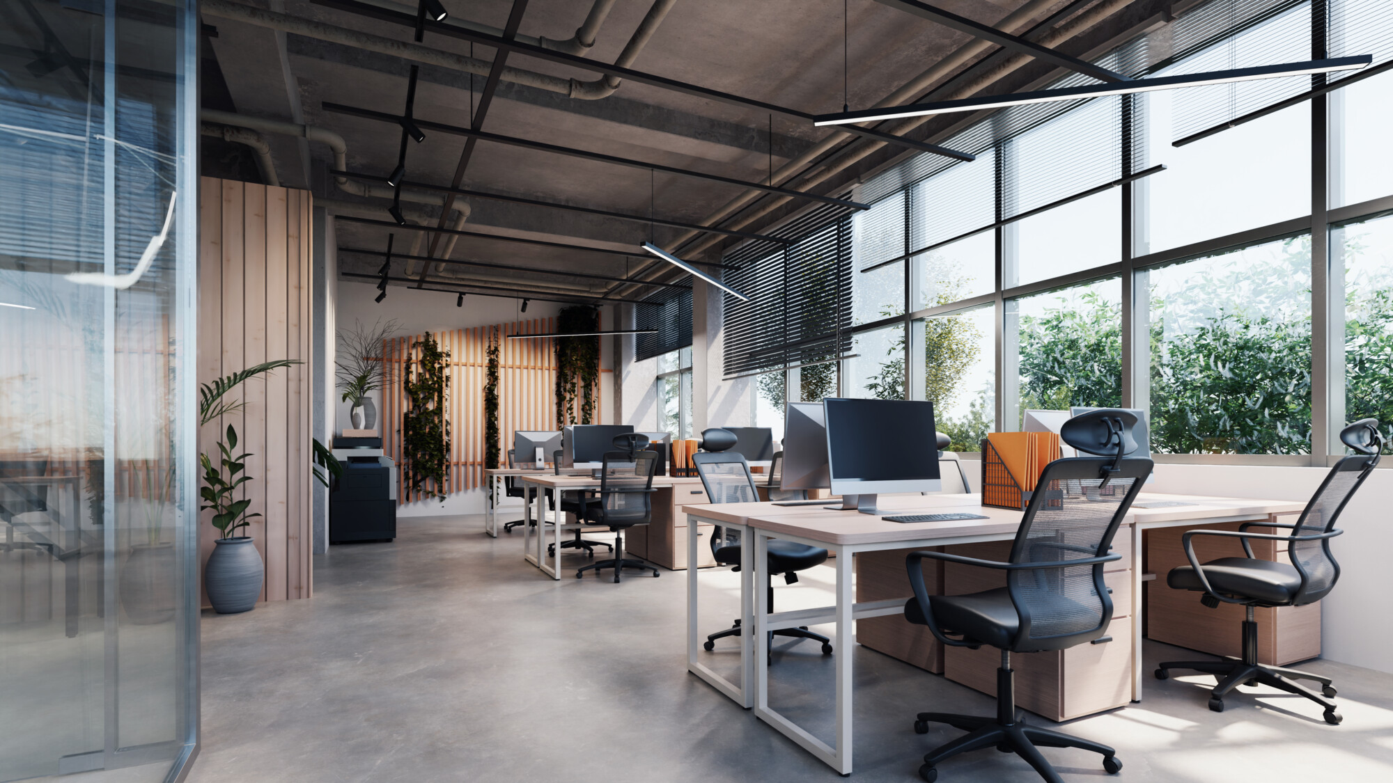 Modern style office with exposed concrete floor and a lot of plants.